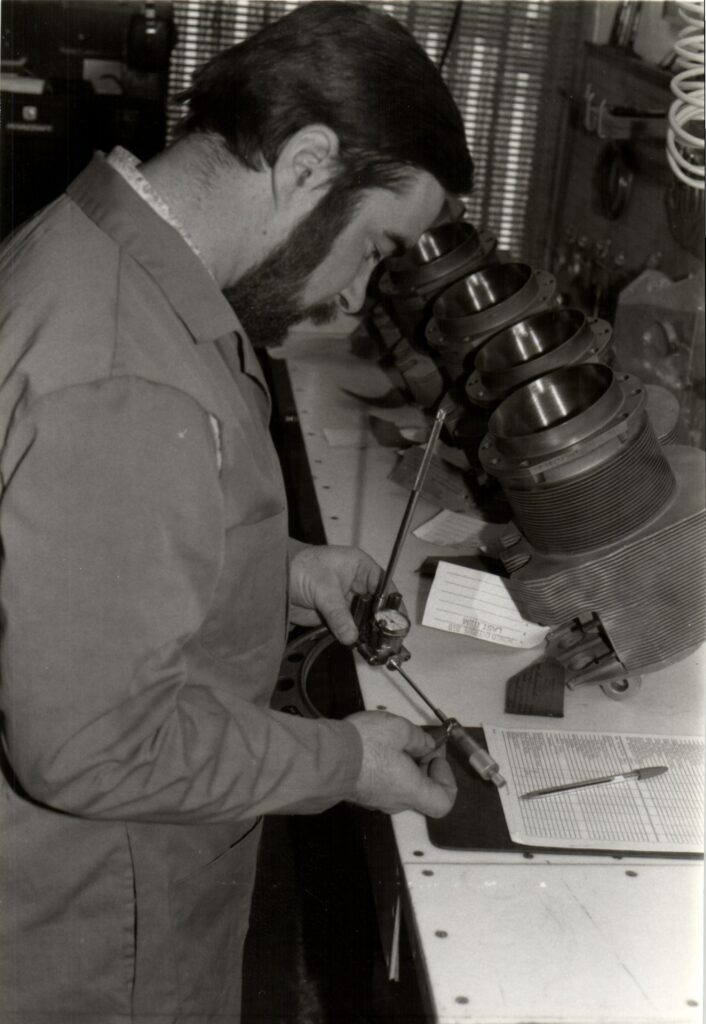 John Alsworth repairing aircraft cylinders in 1980